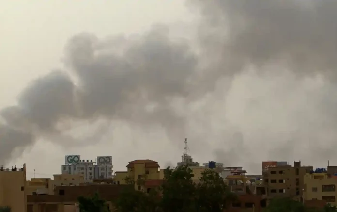 Smoke billows over buildings in southern Khartoum on Monday, as fighting between the forces of two rival generals continues. Photograph: AFP/Getty Images