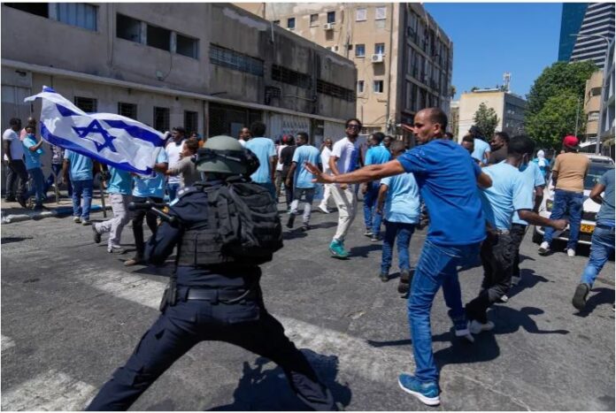 Supporters and critics of Eritrean government engage in violent clashes at a pro-government event in Tel Aviv.